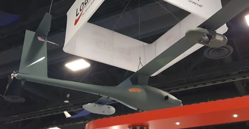 The Platform Aerospace Vanilla Unmanned Group 3 aircraft on display at the 2021 AUSA trade show in Washington, DC. The aircraft is displayed with Logos Technologies' RedKite electro-optical wide-area motion imagery pod (foreground) and BlackKite infrar...