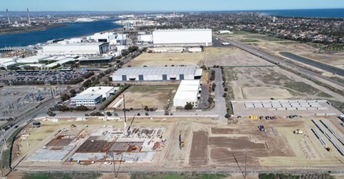 A view of the work that was started at Australia's submarine construction facility at Osborne North. The foreground is where the shipyard is planned to be located, and the existing buildings include the land-based test facility and the combat managemen...