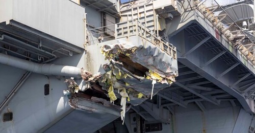 Aircraft carrier USS 
        
         (pictured here) is in Greece undergoing repairs for collision damage.