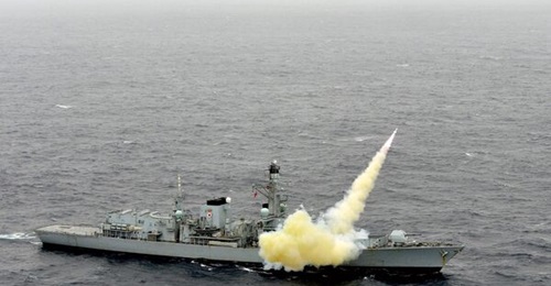 HMS 
        
         fires a Harpoon Block1C anti-ship missile. The Interim Surface-to-Surface Weapon programme to succeed Harpoon, which retires in December 2023,  has been paused to review the investment case.