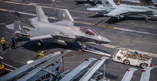 A F-35C taxis on the flight deck of Nimitz-class aircraft carrier USS 
        
         (CVN 70) in the South China Sea on 31 October 2021. A new USN strategy document reaffirms the importance of CVNs to future air power despite the platform'...