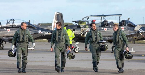 Student pilots and instructors at RAF Valley shortly after completing a training sortie aboard the Textron T-6 Texan II.