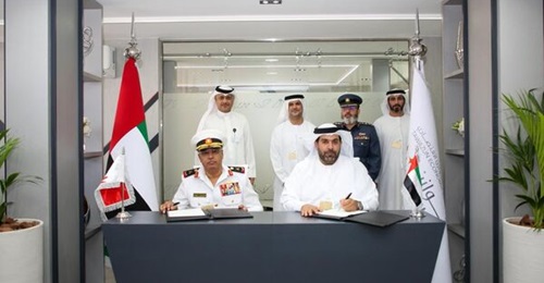 Rear Admiral Yusef Ahmed Malallah, Assistant Chief of Staff for Supply and Logistics at the BDF (l) and Matar Ali Al Romaithi, Chief Economic Development officer at Tawazun (r) sign an MoU on defence industrial collaboration at the 2021 Dubai Airshow.