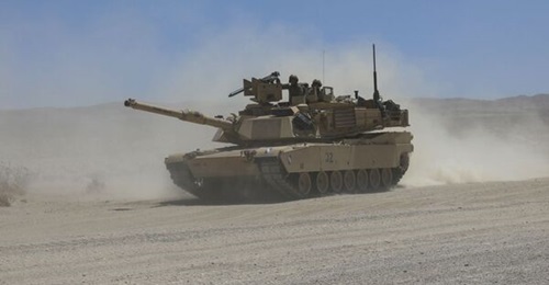 An M1A2 Abrams tank assigned to the 155th Armored Brigade Combat Team with the Mississippi Army National Guard manoeuvres through 'the box' on 8 June at the National Training Center at Fort Irwin, California. The US Army has requested less funding for ...