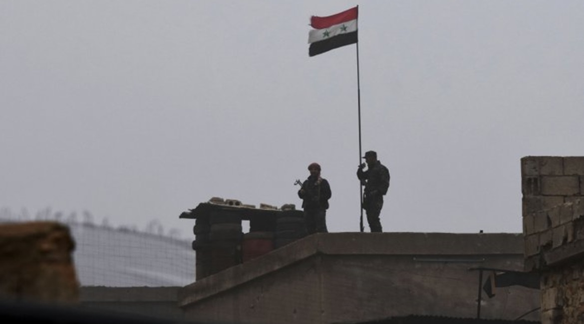 Syrian government troops are seen at a position south of Manbij on 30 December.