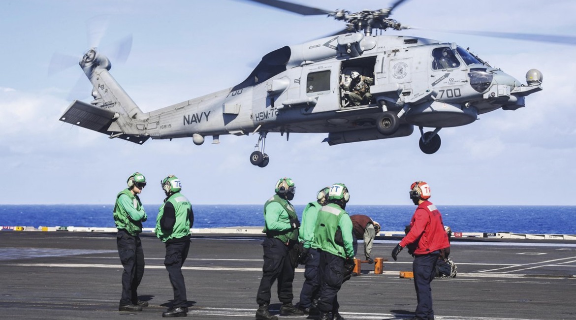 The MH-60R Seahawk helicopter, assigned to the 'Proud Warriors' of HSM 72, prepares to land aboard the Nimitz-class aircraft carrier USS 
        
         in November 2018. The USN is going ahead with plans to build a new, FVL light- to mediu...