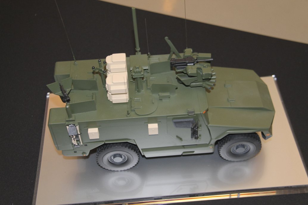 A scale model of Serval fitted with a roof-mounted remote weapon station at the front, acoustic detection system, situational awareness system, counter-improvised explosive device equipment, and pintle-mounted machine gun. (Christopher F Foss)