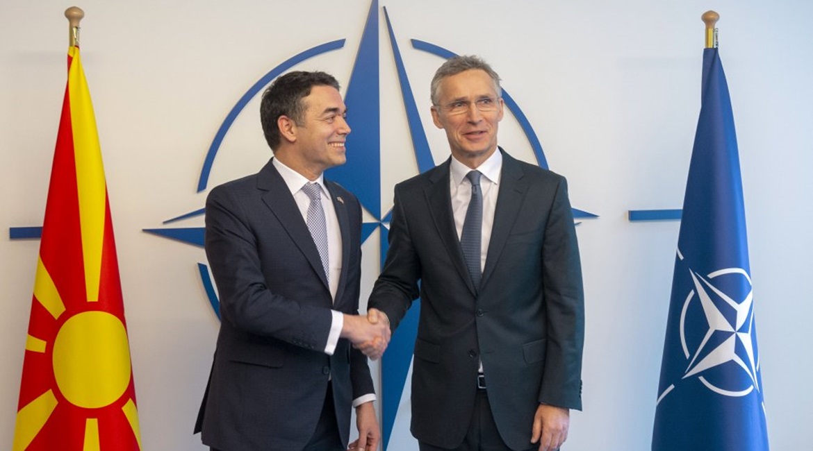 The accession protocol for Macedonian membership in NATO was signed on 6 February in the presence of the country's foreign minister, Nikola Dimitrov (left, shaking hands with Secretary General Jens  Stoltenberg).