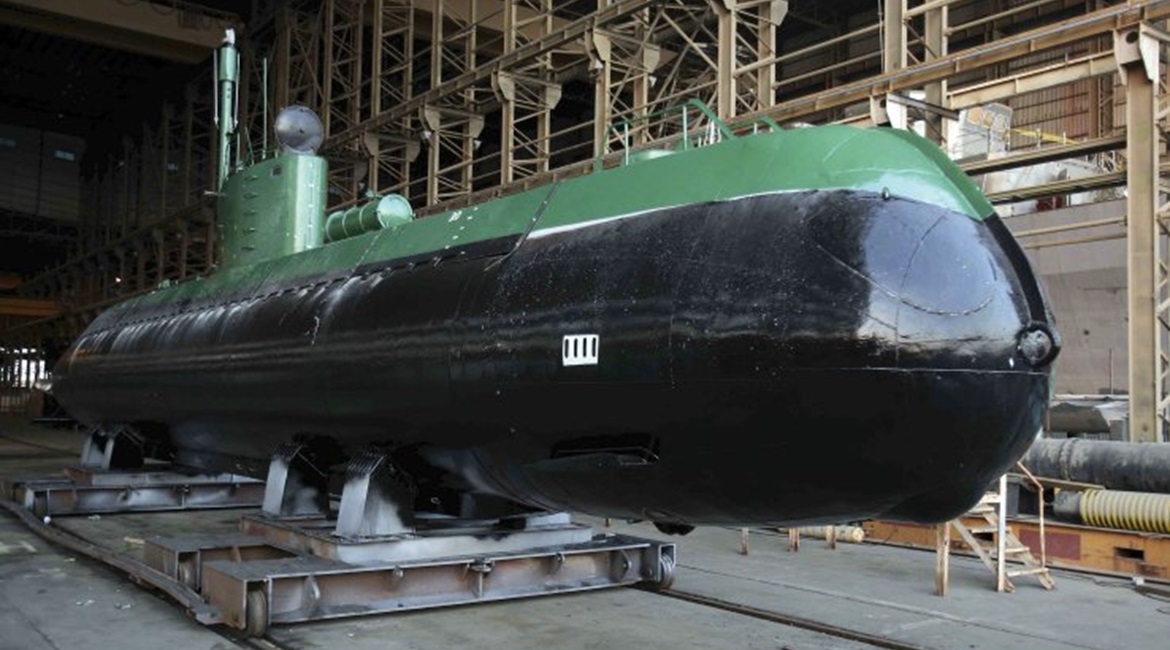 A Ghadir submarine is seen out of the water. It is unclear if the submarine-launched missile is a short-range weapon developed for the class or whether one of the midgets is being used as a test platform for a missile designed for the new Fateh class.