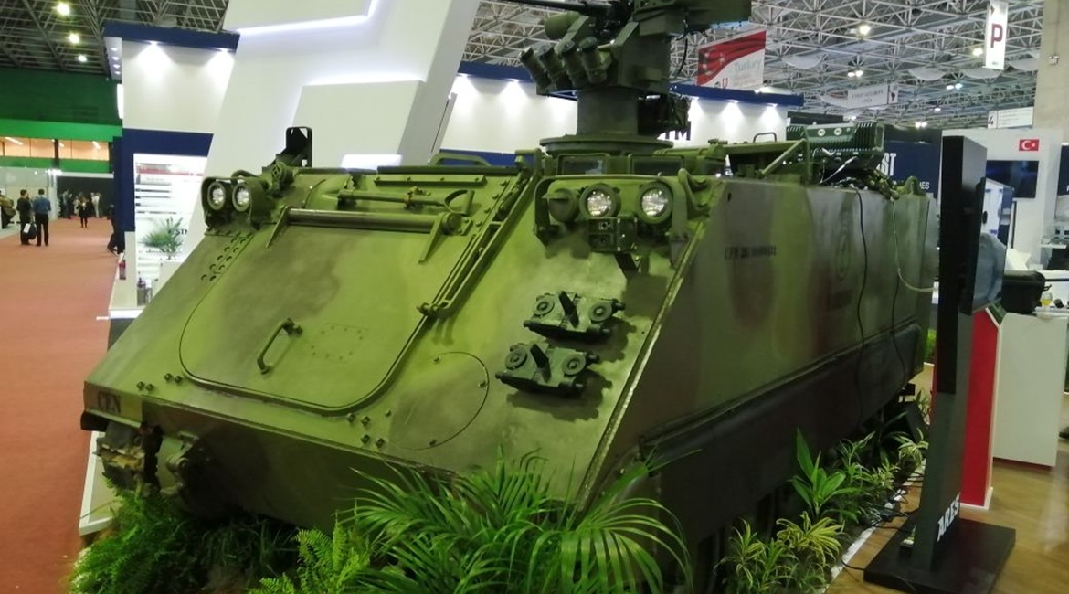 An M113 MB1 APC is shown with the REMAX III weapon station and Sentinel and IronVision systems.