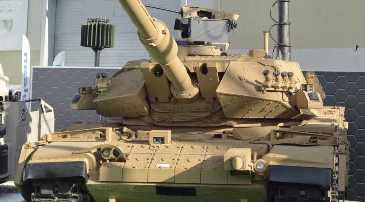 The latest upgraded M60TM tank for the Turkish Land Forces Command, fitted with a retractable mast-mounted sensor pack and one of the Pulat active protection system munition modules on the front of the vehicle.