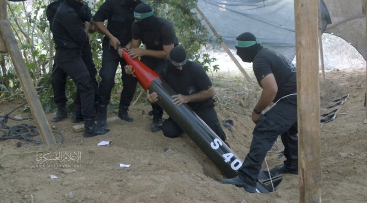 A still from a video released by the Al-Qassam Brigades on 6 May 2019 shows Palestinian militants lowering an S 40 rocket into one of several launchers that have been buried in the ground.