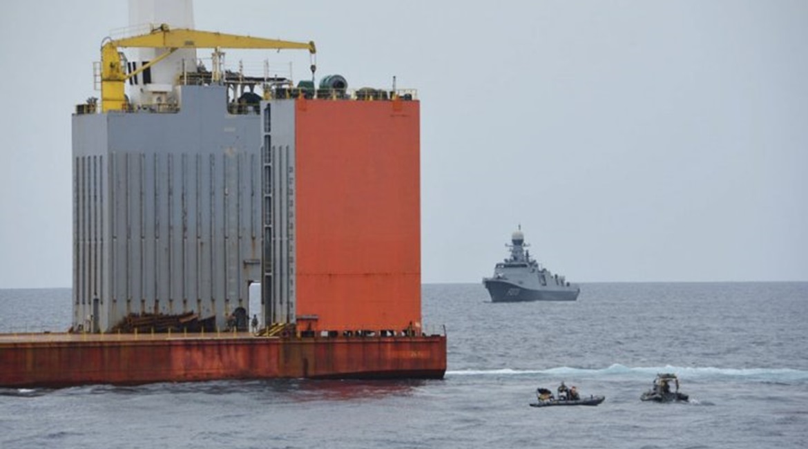 The Equatorial Guinea navy frigate 
        
         is seen behind 
        
         after it was boarded by the Spanish marines on 6 May.