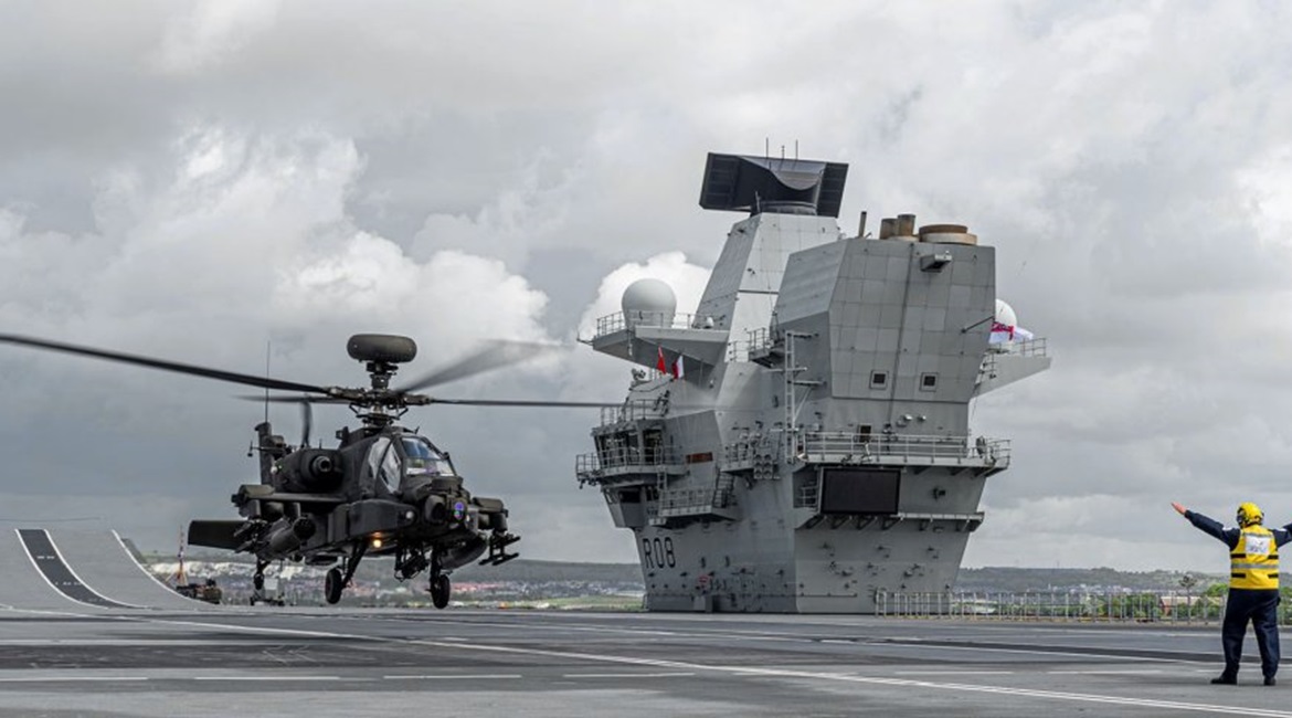 A British Army Apache AH1 landed on HMS 
        
         for the first time on 3 June. The UK has committed the carrier to NATO's Readiness Initiative.