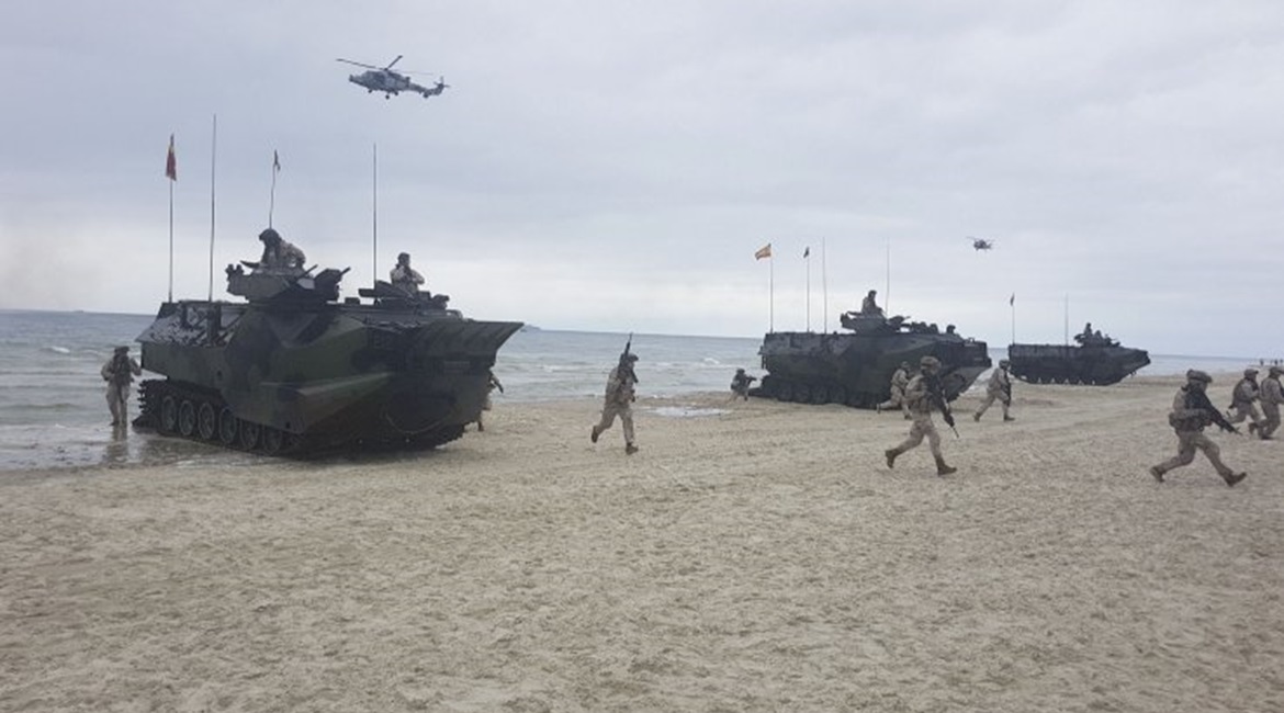 Spanish marines and armoured amphibious assault vehicles, deployed from the US Navy's Whidbey Island-class LSD amphibious assault ship USS 
        
        , come ashore on Palanga Beach, Lithuania, in an amphibious demonstration during 'BALT...