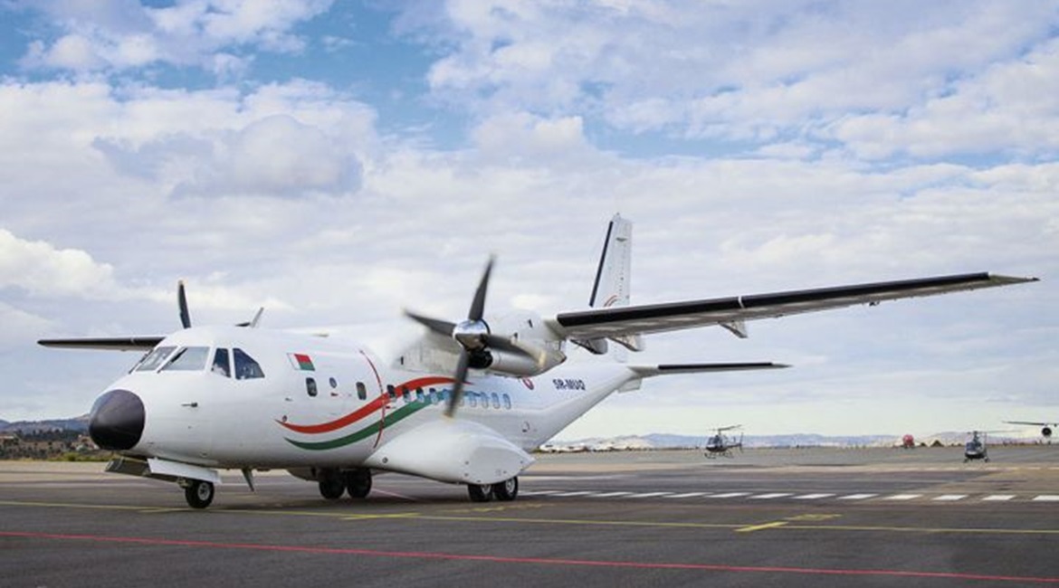 Madagascar's new CN235 transport aircraft and two of the three AS350B2 helicopters are seen during the official handover ceremony at Ivato International Airport on 24 June.