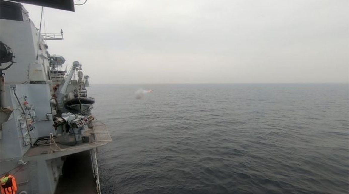 A Martlet missile being fired from a five-canister LMM/Martlet pannier co-mounted with the MSI-Defence Systems 30 mm DS30M Mark 2 gun on the RN Type 23 frigate HMS 
        
         at a fast moving FIAC-representative speedboat off the MOD A...