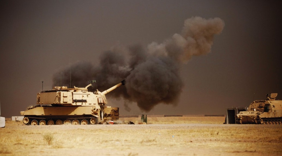 A US Army M109A6 Paladin howitzer conducts a fire mission at Qayyarah West Airfield in Iraq as coalition forces move towards Mosul. The army's ERCA effort is designed to increase the M109A7's range and rate of fire. (US Army)