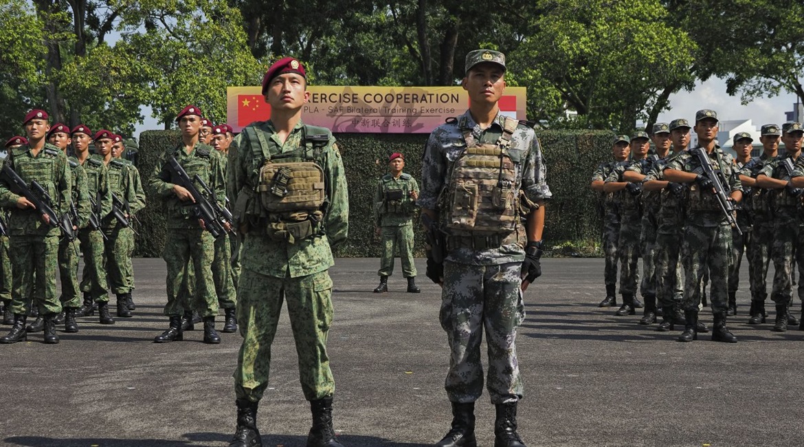 Participating units from the Singapore Armed Forces and the People's Liberation Army stand at attention during the opening ceremony of Exercise 'Co-operation 2019'.
