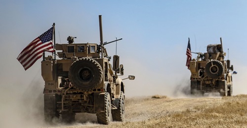 A US military convoy participates in joint patrol with Turkish troops in the Syrian village of al-Hashisha on the outskirts of Tal Abyad town along the border with Turkish troops on 8 September. The US and Turkey have begun joint patrols in northeaster...