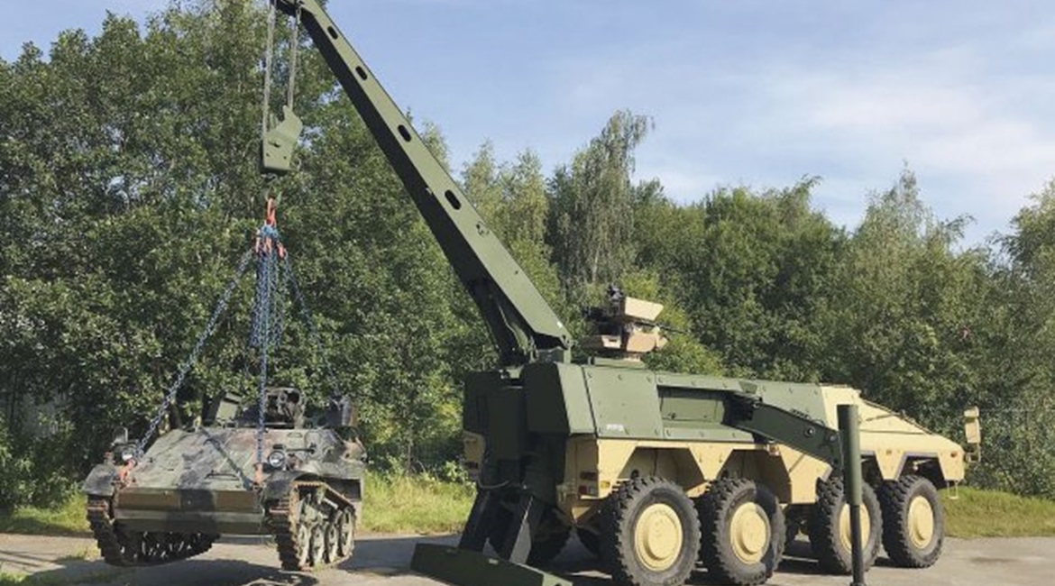 The FFG Boxer Armoured Recovery Module lifting a Wiesel light armoured vehicle.