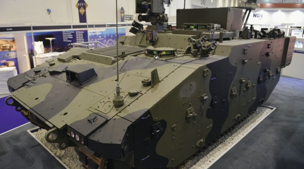 The Athena C2 variant of the Ajax AFV family. It can be distinguished from the Ares APC by the raised superstructure and large box on the roof of the vehicle.