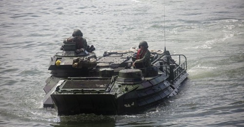 Philippine and US marines drive a Philippine KAAV onto BRP 
        
         (602) in late August.