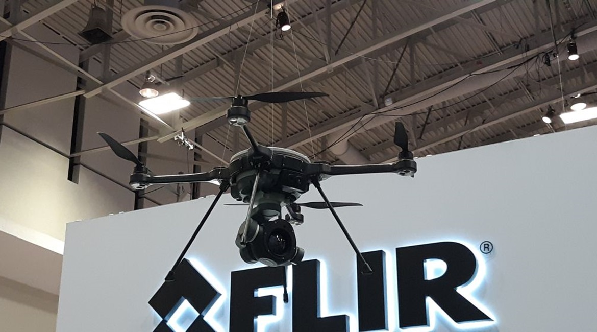 FLIR Systems' R80D SkyRaider multi-mission unmanned rotorcraft on display at the 2019 AUSA convention. The large camera on the bottom of the aircraft is a new StormCaster-T thermal camera with FLIR Boson sensor.