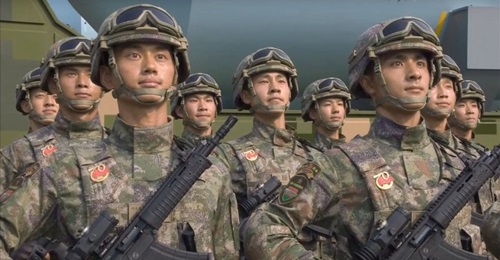 Chinese soldiers carrying a new type of assault rifle during a military parade held at Tiananmen Square in Beijing on 1 October 2019.
