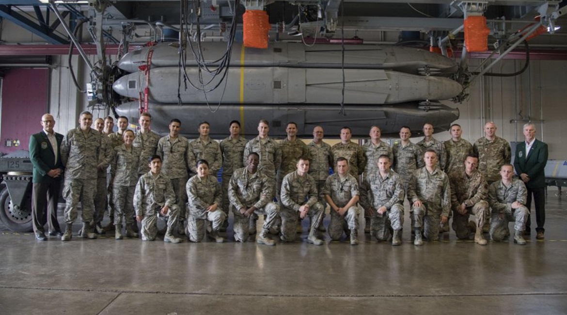 Current and retired service personnel from the 2nd Bomb Wing pose in front of the final Conventional Air-Launched Cruise Missile package at Barksdale Air Force Base, Louisiana, on 20 November. The CALCM missile package is being retired and replaced by ...
