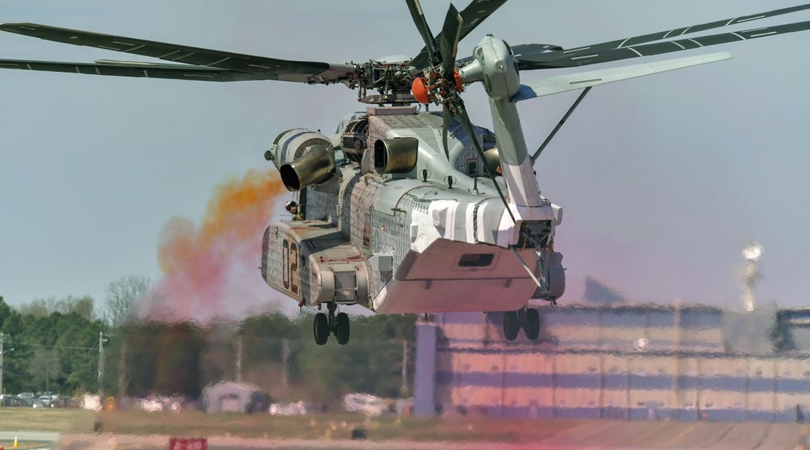 A CH-53K performs EGR testing on 4 April. The coloured oil smoke indicates rotor wake.