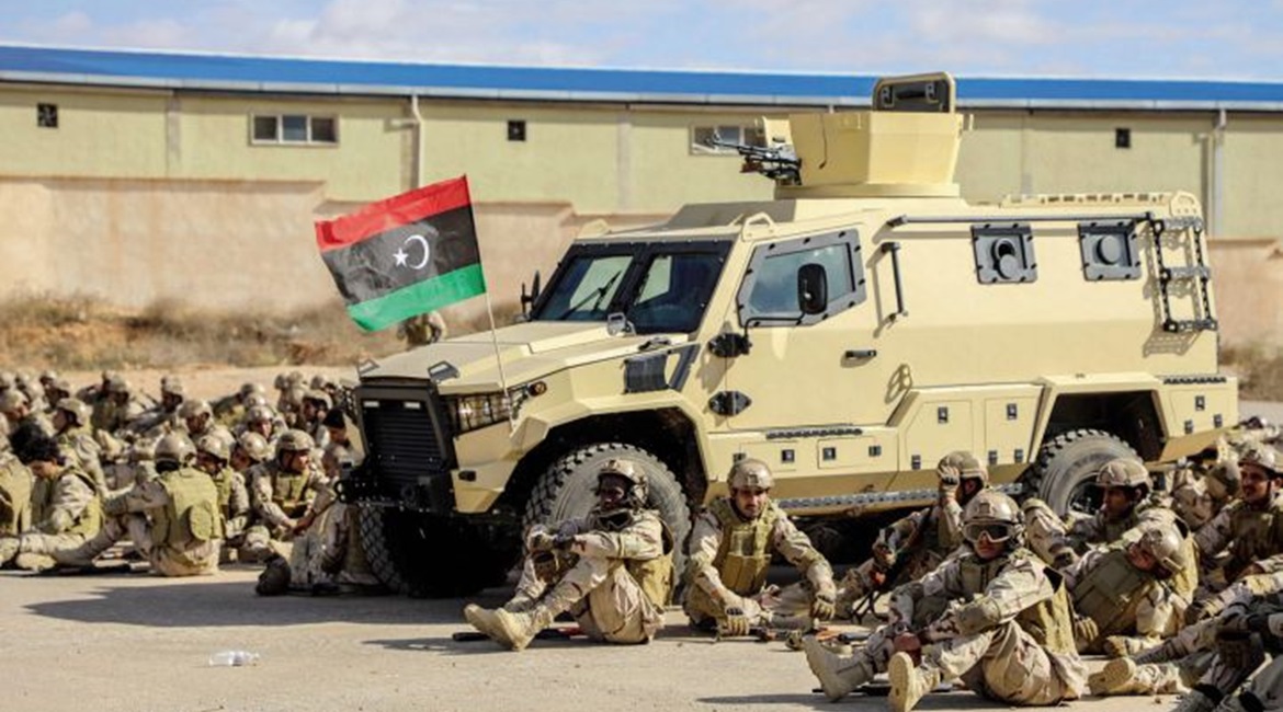 106th Brigade soldiers relax next to what appears to be a TAG Terrier LT-79.