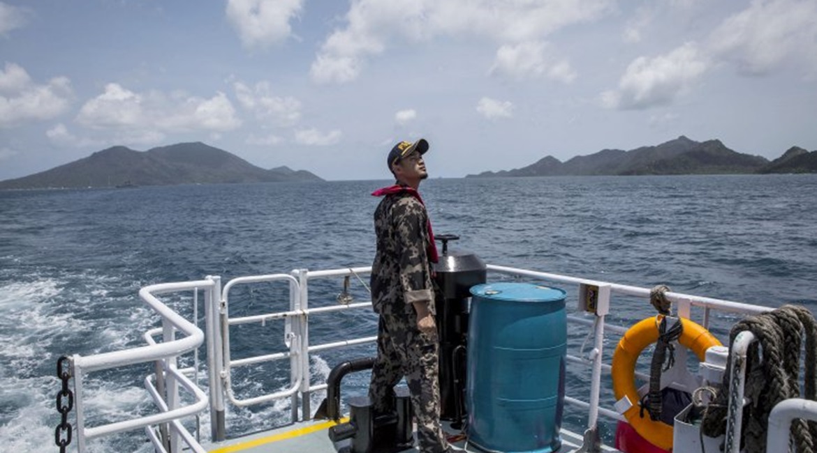 An Indonesian Ministry of Maritime Affairs and Fisheries official prepares to conduct security patrols in the Natuna Islands region