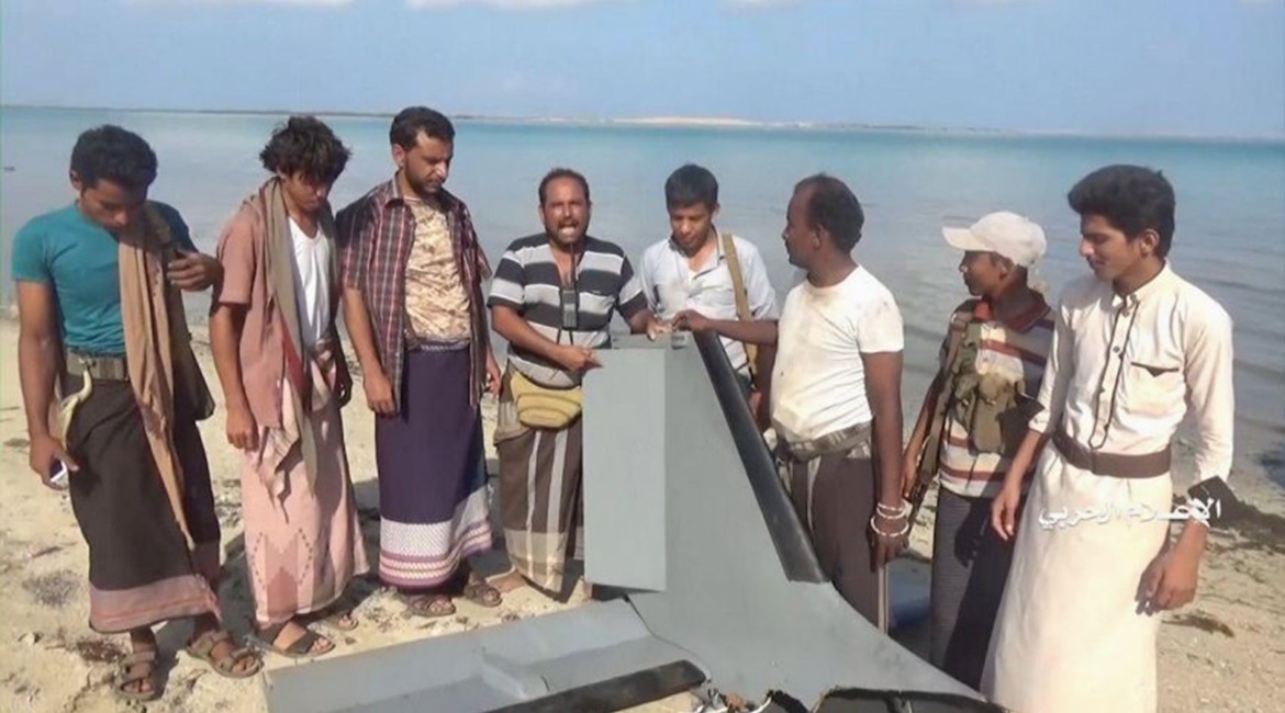 A still from a video released by Ansar Allah (Houthis) on 31 December 2019 shows armed men recovering the wreckage of an aircraft identified as a Karayel UAV operated by Saudi Arabia
