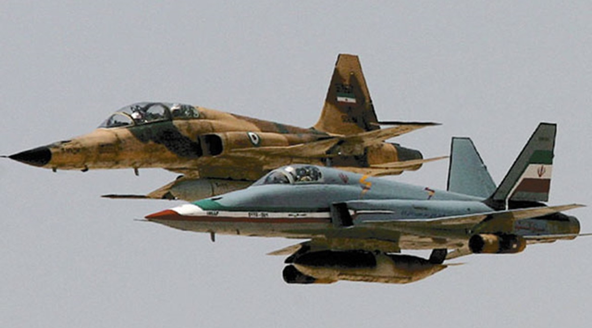 The twin-tailed Saeghe (foreground) in formation with an F-5F during military exercises. Iran fields a fighter force that is made up of either ageing types received from abroad, or domestically-developed types of questionable capabilities. it is doubtf...