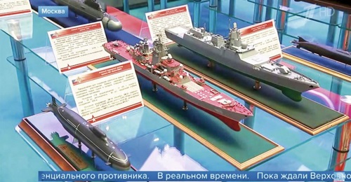A still taken from a news report on Russia's Channel One television station aired on 24 December 2019 shows the Project 585 submarine (left) and upgraded Project 11442M cruiser (centre).