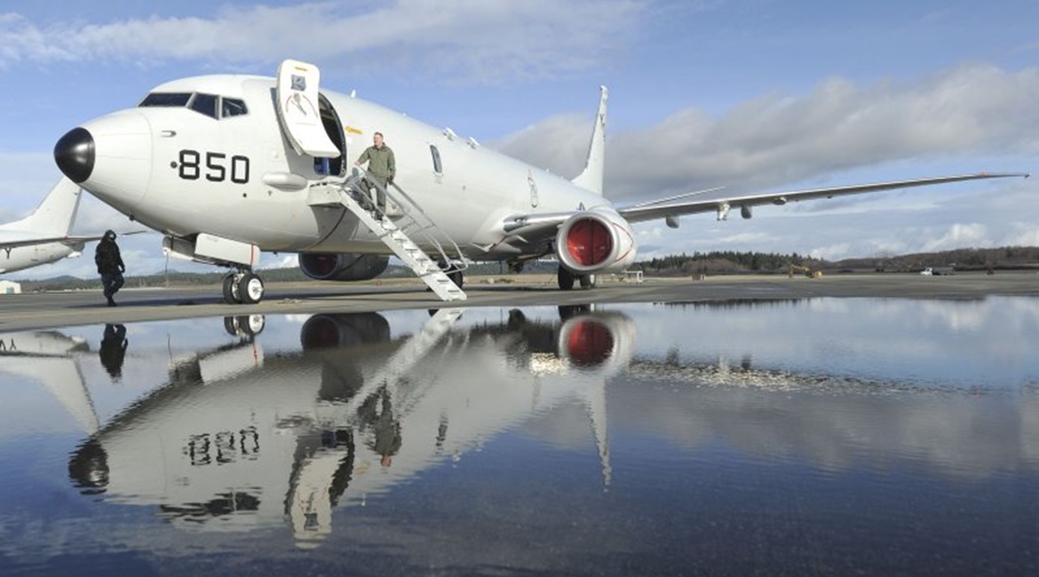 A P-8A is pictured undergoing maintenance at Naval Air Station Whidbey Island prior to an operational deployment.