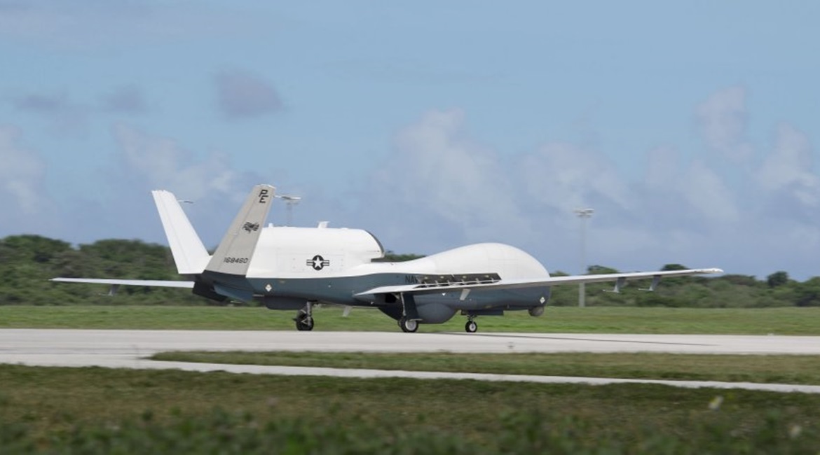 An MQ-4C Triton unmanned aircraft system (UAS) taxis after landing at Andersen Air Force Base for a deployment as part of an early operational capability (EOC) to further develop the concept of operations and fleet learning associated with operating a ...