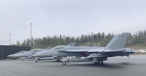 Boeing F/A-18 E and F Super Hornets, and an E/A-18G Growler at Pirkkala Air Force Base for the Finnish Air Force's HX Challenge.
