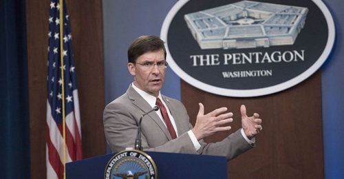 Defense Secretary Mark Esper briefs reporters about the department's Covid-19 response at the Pentagon on 17 March.