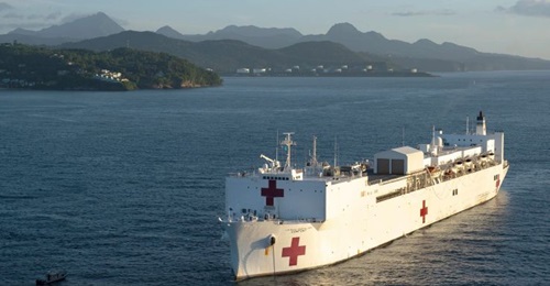 The hospital ship USNS 
        
         is anchored off the coast of Castries, St. Lucia, in September 2019. The Pentagon has announced plans to deploy the ship to New York to help with the Trump administration's COVID-19 response.