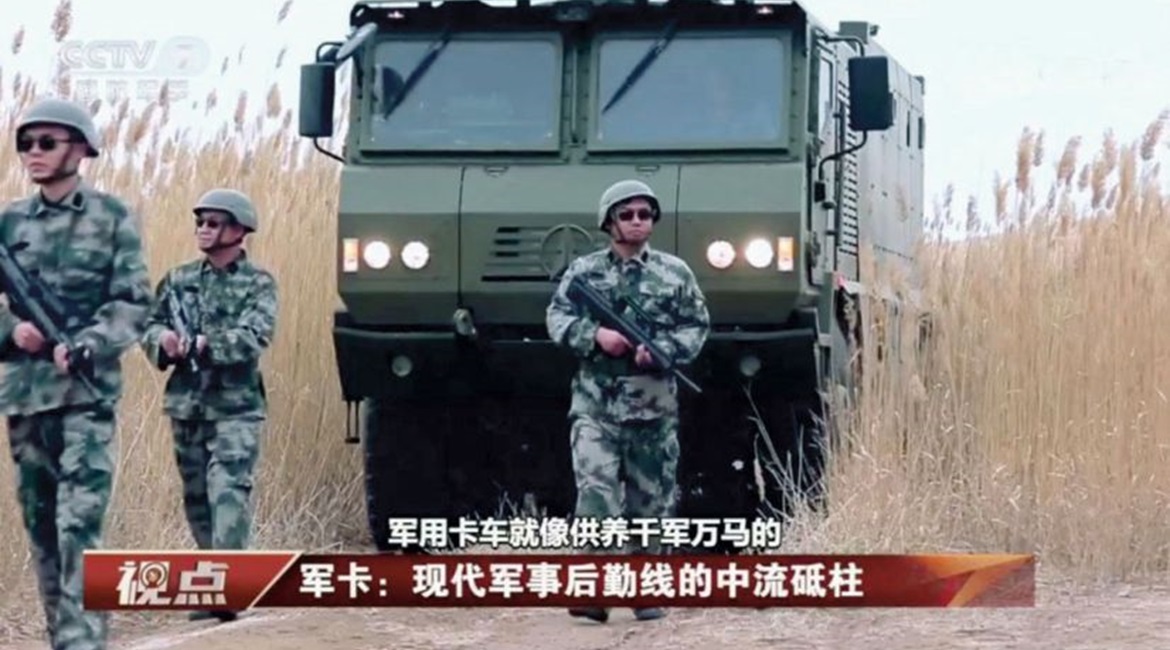 A screengrab of a CCTV 7 report showing the Norinco VP22 armoured transport vehicle being deployed alongside what appear to be PLA infantry troops.