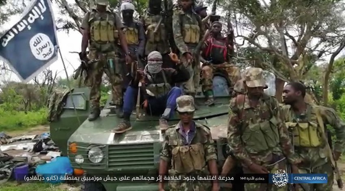 Militants in Mozambique pose with a captured ZBF-05 armoured personnel carrier in a photograph released by the Islamic State's Amaq News Agency on 2 February.