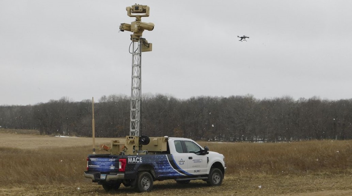 Northrop Grumman's Mobile Acquisition and Cueing Effector (M-ACE) hunter/killer CUAS prototype demonstrator, with the extended SDS-12 stabilised aluminium tower, based on a dedicated Ford F250 platform