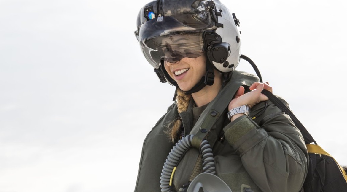 Captain Anneliese Satz walks to her F-35B to begin flight checks for a training flight aboard Marine Corps Air Station Beaufort 11 March 2019. The F-35's HMD was redesigned with organic light emitting diodes (OLEDs), which reduced a green glow and brig...
