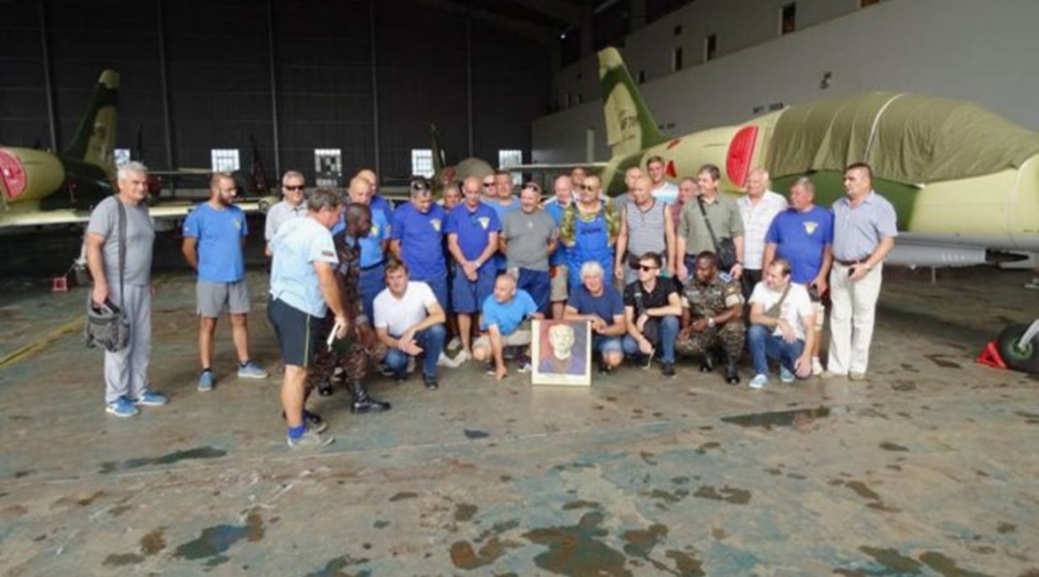 Personnel from Ukraine's Odessa Aviation Plant (OAP) pose in front of L-39 jets at Uganda's Gulu Air Base.