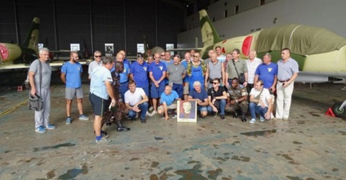 Personnel from Ukraine's Odessa Aviation Plant (OAP) pose in front of L-39 jets at Uganda's Gulu Air Base.