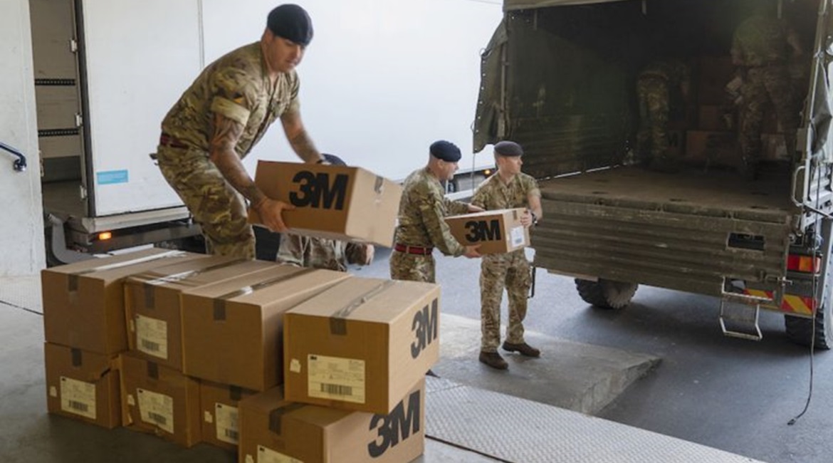 UK military personnel delivering boxes of PPE face masks to St Thomas Hospital in London on 24 March.