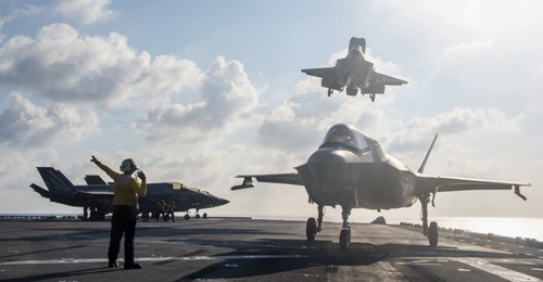 A F-35B assigned to the 31st Marine Expeditionary Unit, Marine Medium Tiltrotor (VMM) 265 (Reinforced), lands on the flight deck of amphibious assault ship USS America (LHA 6) on 19 April 2020. The Pentagon is expecting a three-month slowdown in major ...