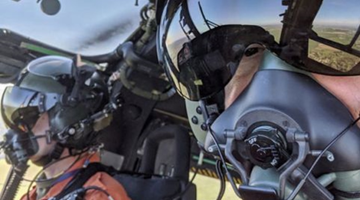 Leonardo Helicopters UK flight test crew demonstrate the newly adapted helmet and facemask that is designed to enable crews to fly during the coronavirus pandemic.